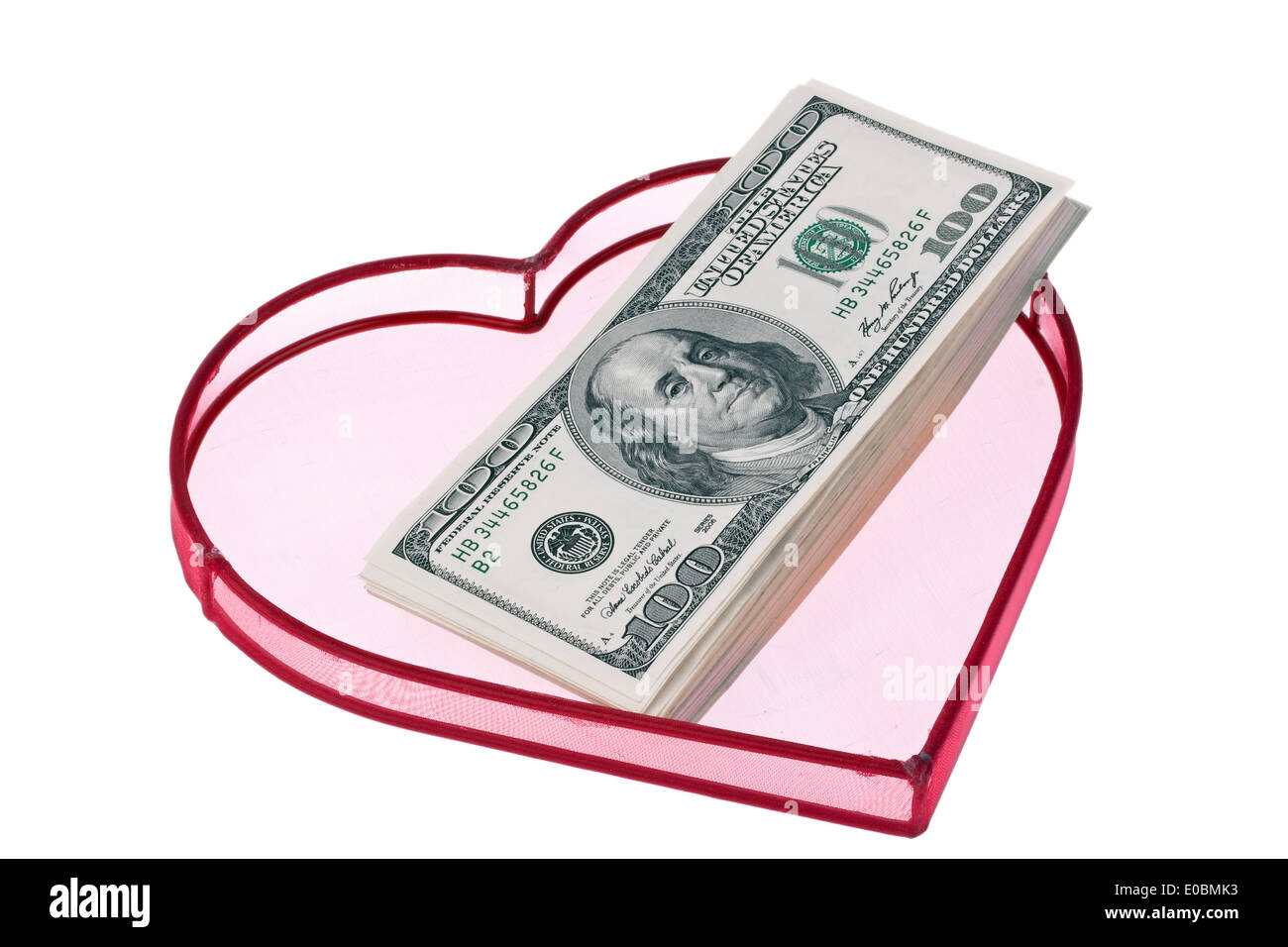 Eine Menge von Dollar von Banknoten in Herzform auf weißem Hintergrund, Viele Dollar Geldscheine in Einem Herz Auf Weissem Hintergrund Stockfoto