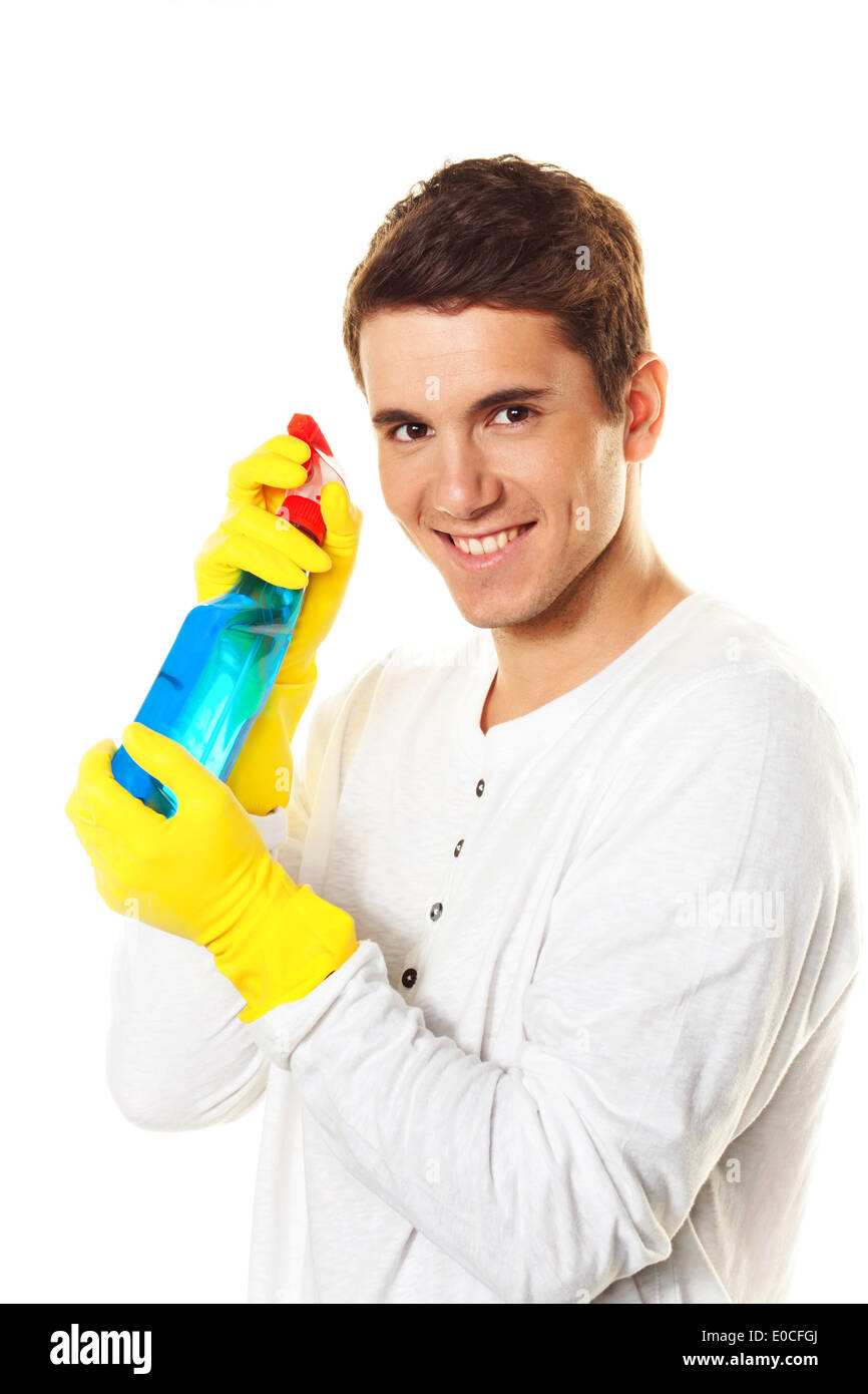 Mann mit Reinigungsmittel. Reinigung der Wohnung. Stockfoto