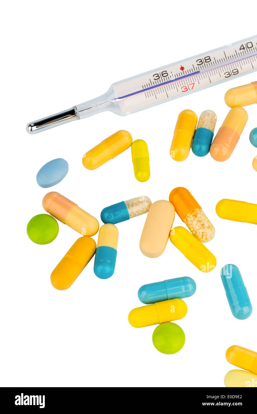 Ein Fieberthermometer und Tabletten. Symbolische Foto für Grippe und Erkältung, Ein Fieberthermometer Und Tabletten. Symbolfoto fuer Stockfoto