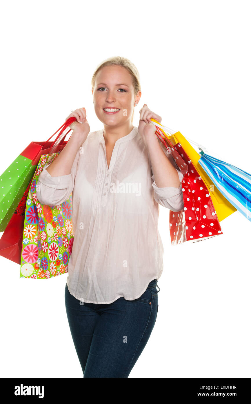 Eine junge Frau mit farbigen Tragetaschen beim Einkaufen. Freut sich über das Schnäppchen., Eine Junge Frau Mit Bunton Einkaufstasc Stockfoto