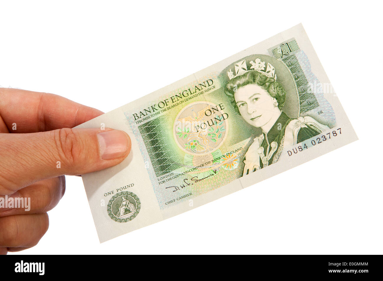 Geld männliche Hand, die alten britischen ein Pfund-banknote Stockfoto
