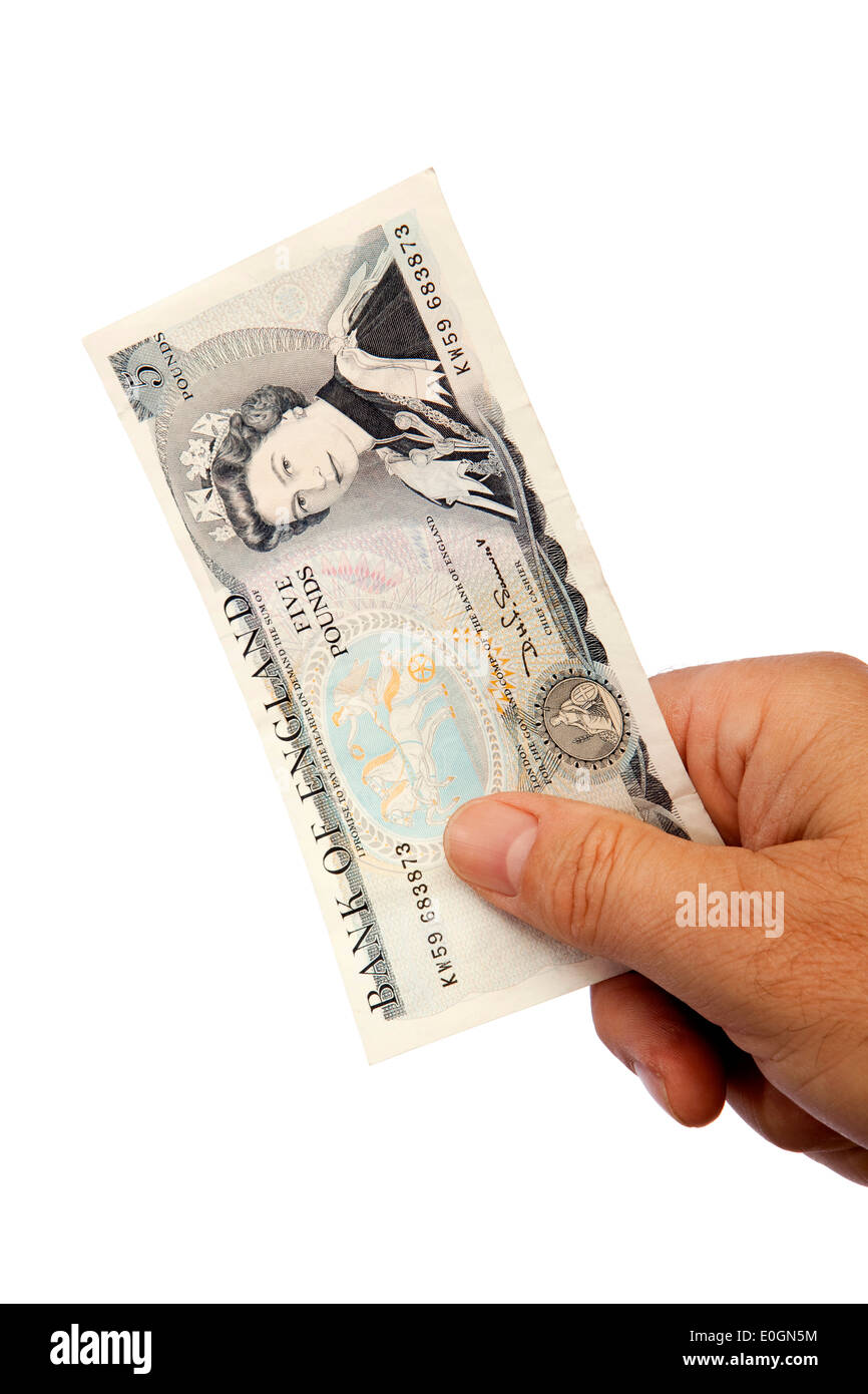 Geld männliche Hand, die alten britischen fünf-Pfund-banknote Stockfoto