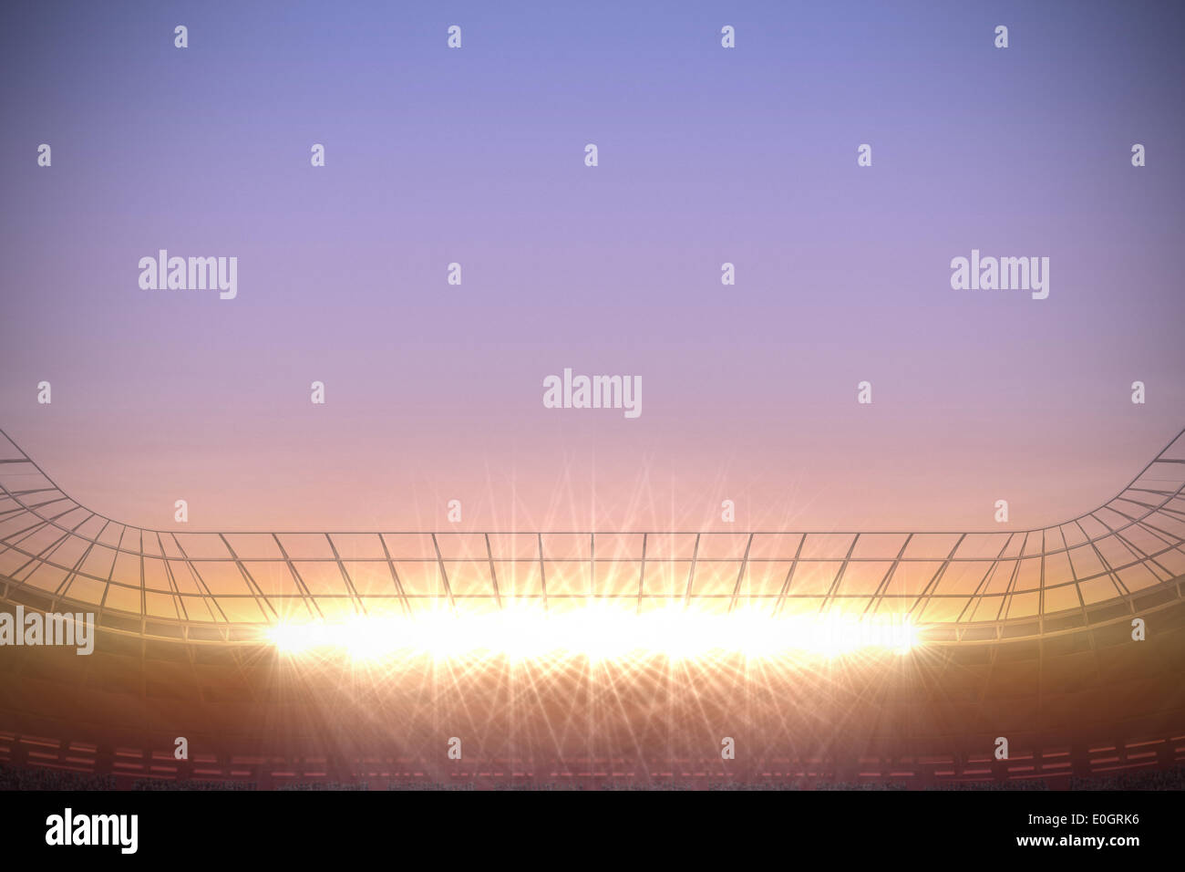 Große Fußball-Stadion unter lila Himmel Stockfoto