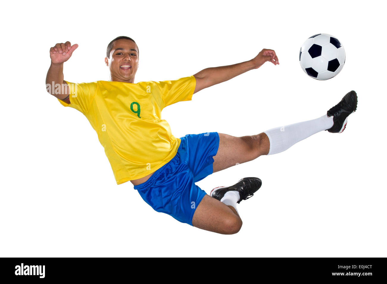 Brasilianischer Fußballspieler, springen, gelb und blau Stockfoto