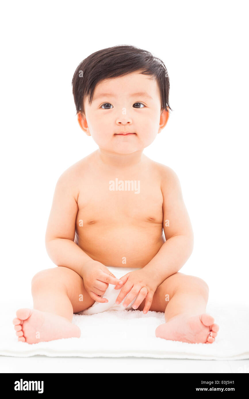 Kind Kind Baby sitzt auf einem weißen Hintergrund Stockfoto