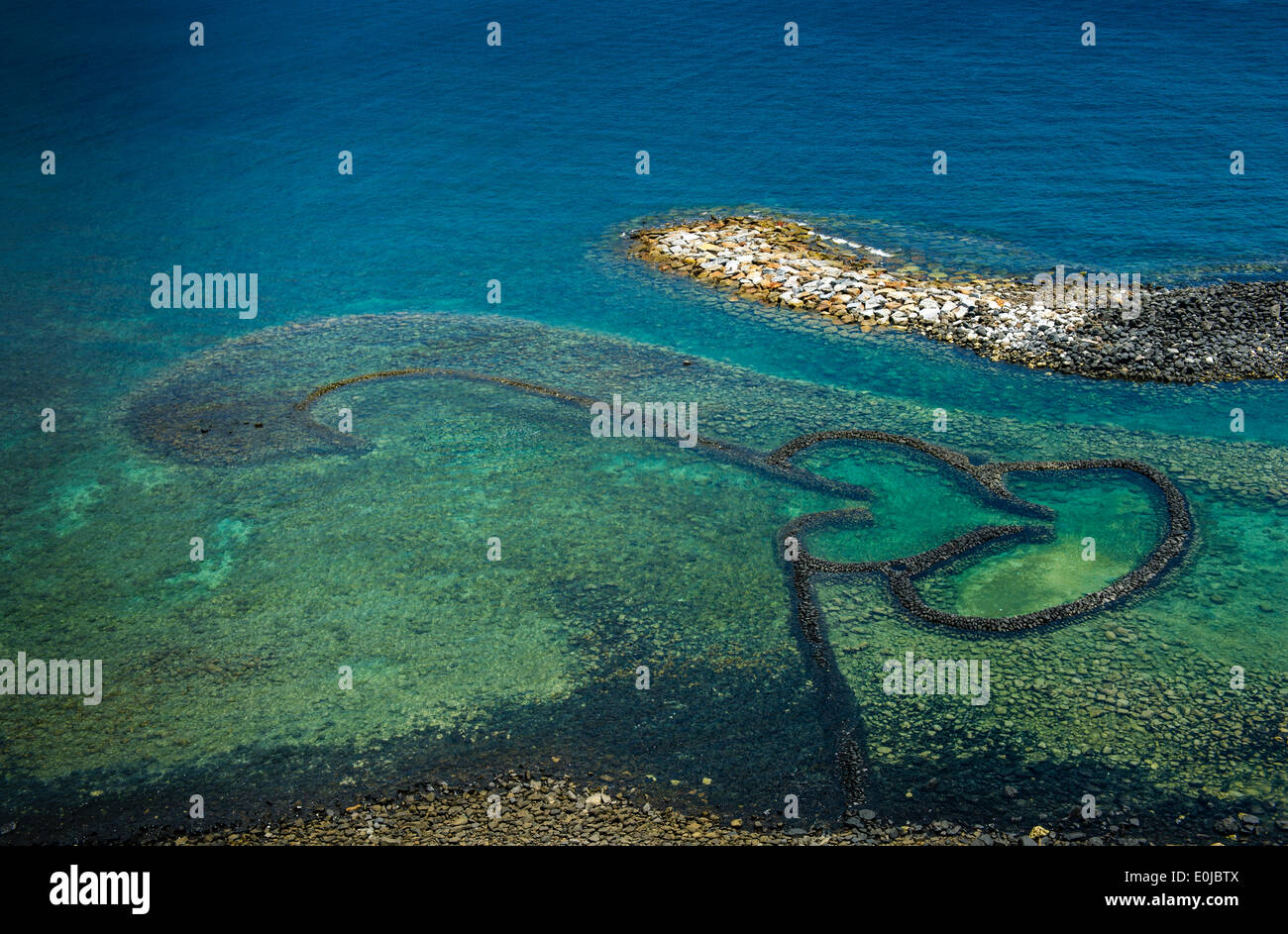 Ein Zwilling Herz Basaltstein Zaun in Penghu-Inseln Stockfoto