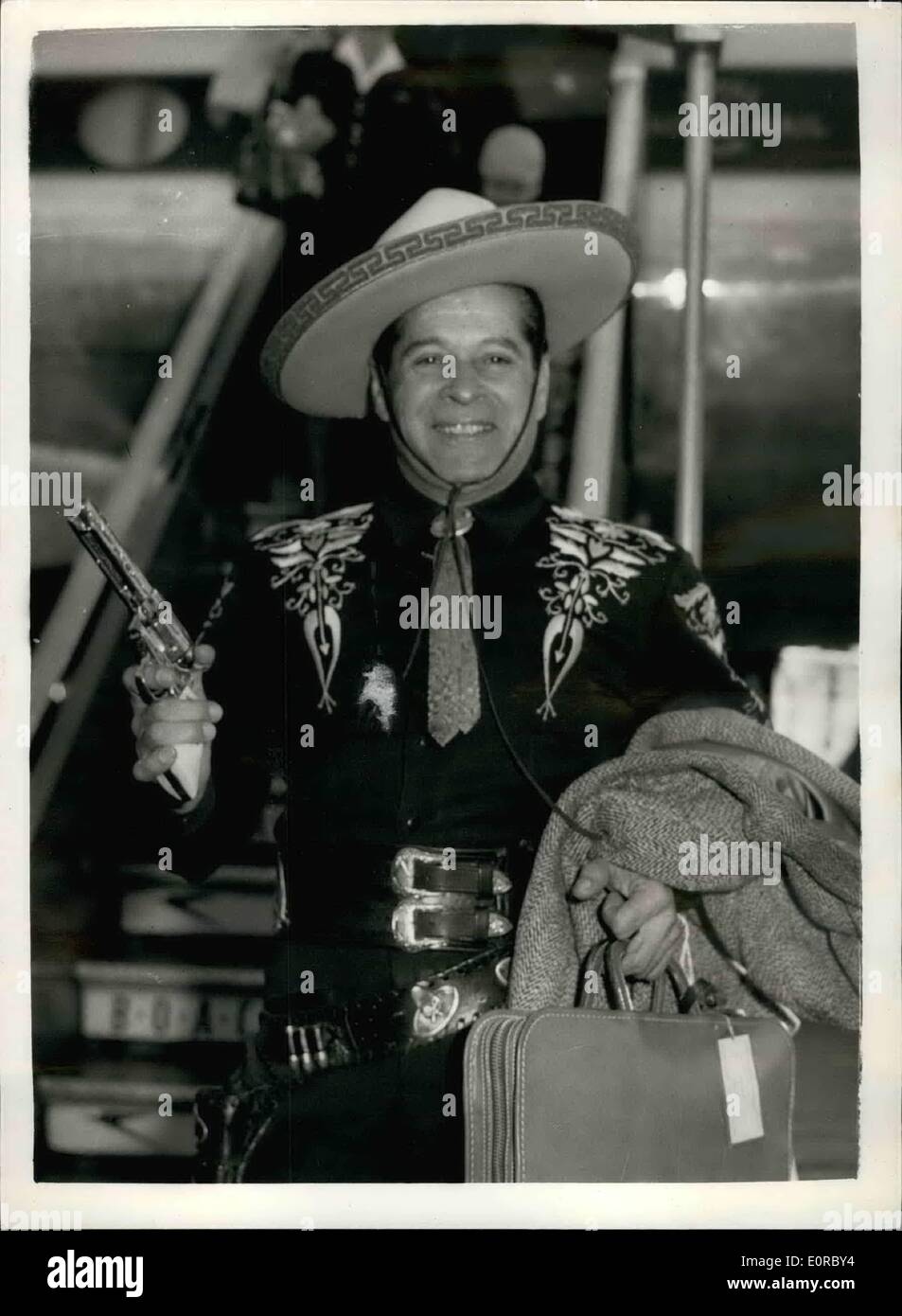 12. Dezember 1958 - The Cisco Kid ankommt: The Cisco Kid - mit bürgerlichem Namen Duncan Renaldo - heute Morgen in London am Flughafen angekommen ist. Er erscheint in der Associated Rediffusion TV-Show '' Lucky Dip'' heute Abend. Foto zeigt: Die Cisco Kid bei seiner Ankunft auf dem Flughafen London Vormittag abgebildet. Stockfoto