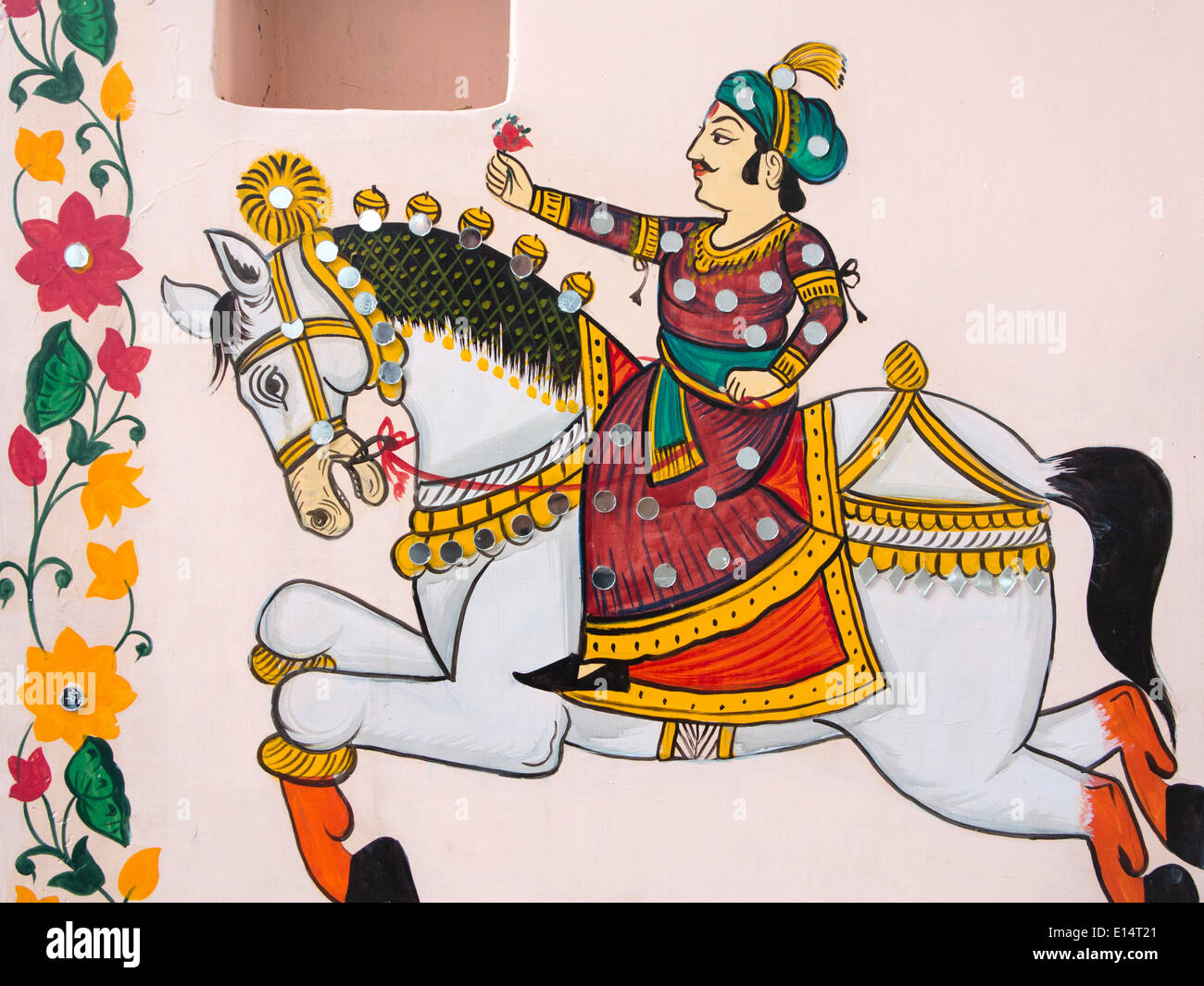 Indien, Rajasthan, Udaipur, Rajasthan Volkskunst Wandmalerei der Rajput Mann auf Pferd mit Blume Stockfoto