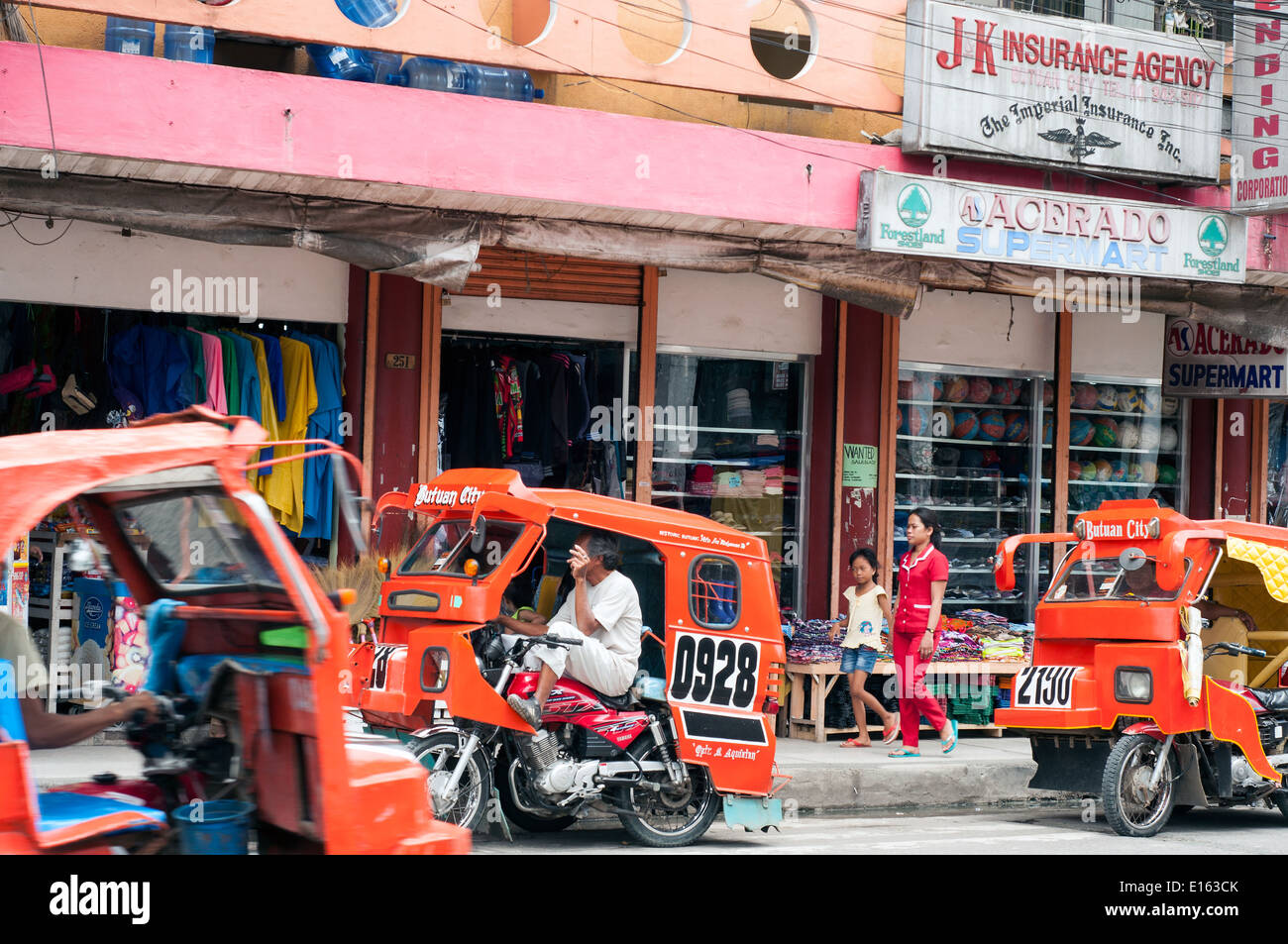 Dreirad-taxis in der Innenstadt von Butuan, Mindanao, Philippinen Stockfoto