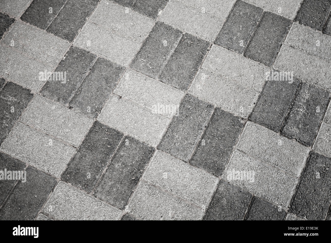 Graue Stadt am Straßenrand Pflaster Muster, Foto Hintergrundtextur Stockfoto