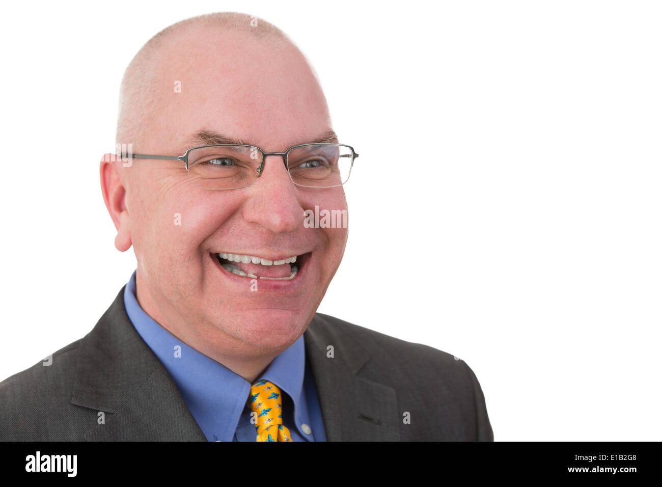 Glücklich jovialen Geschäftsmann mit Blick auf die Seite mit einem strahlenden freundlich lächeln, Kopf und Schultern Porträt auf weißen Brille Stockfoto