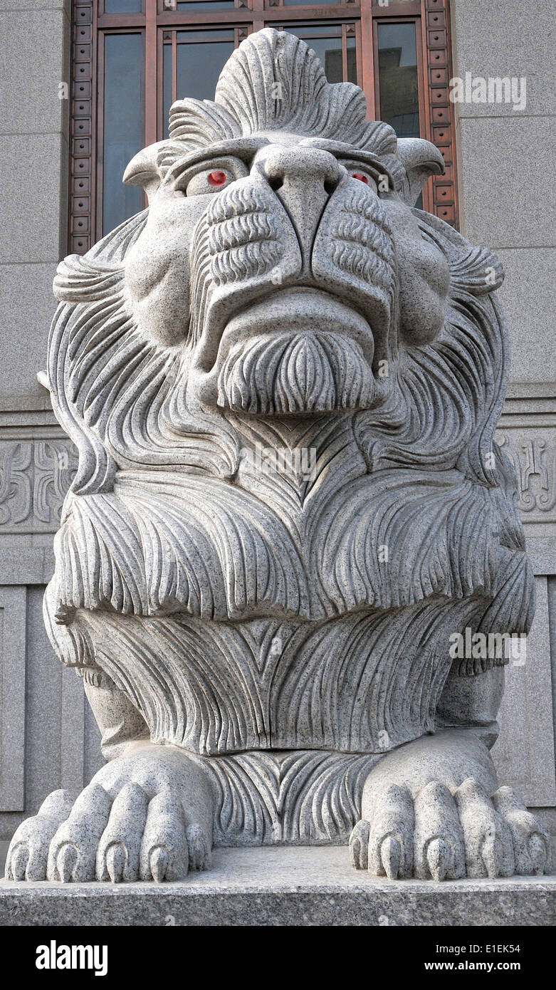 Steinlöwen bewachen XI China Stockfoto