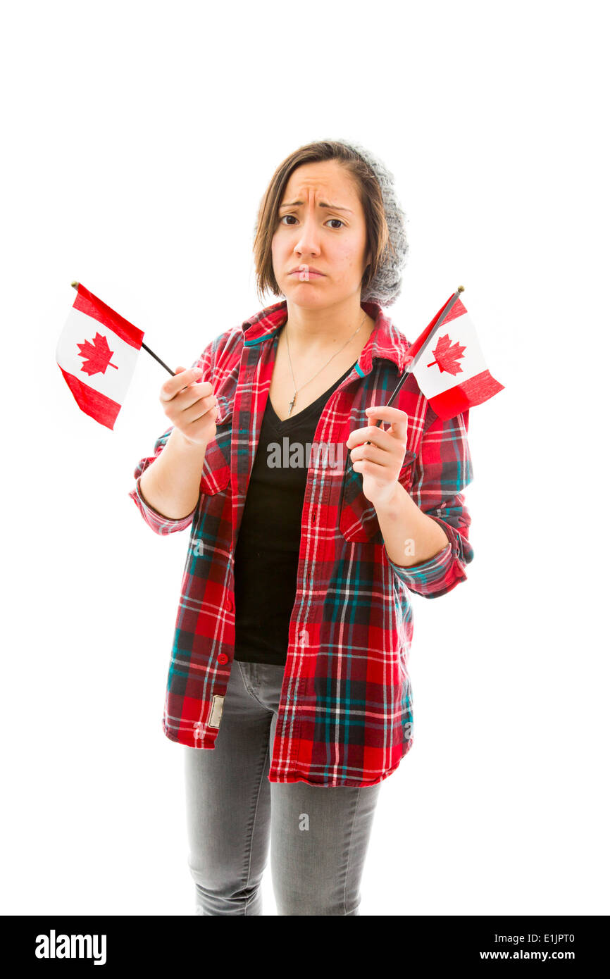Junge Frau, die traurig und Holding-Kanada-Flagge Stockfoto