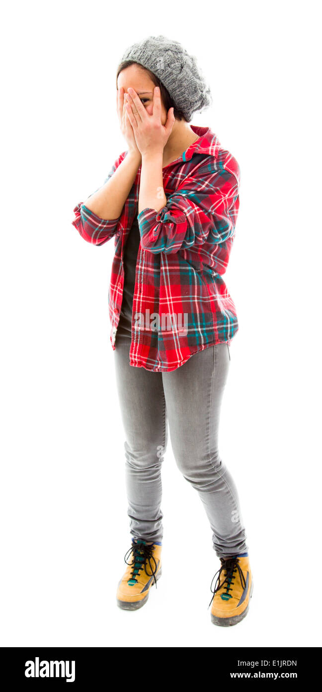 Junge Frau spähen durch Hände, Gesicht Stockfoto