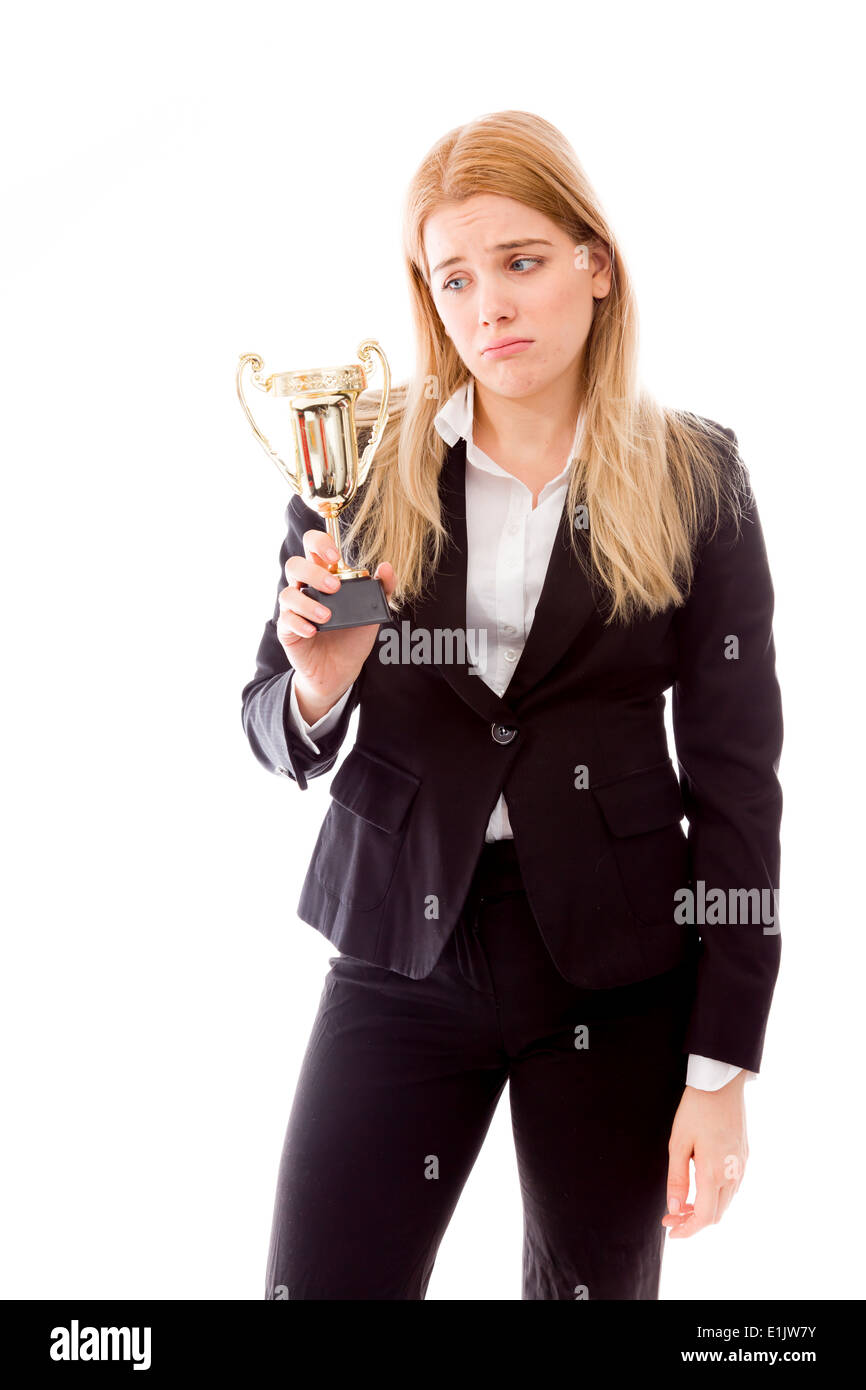 Enttäuscht Geschäftsfrau hält eine goldene Trophäe Stockfoto