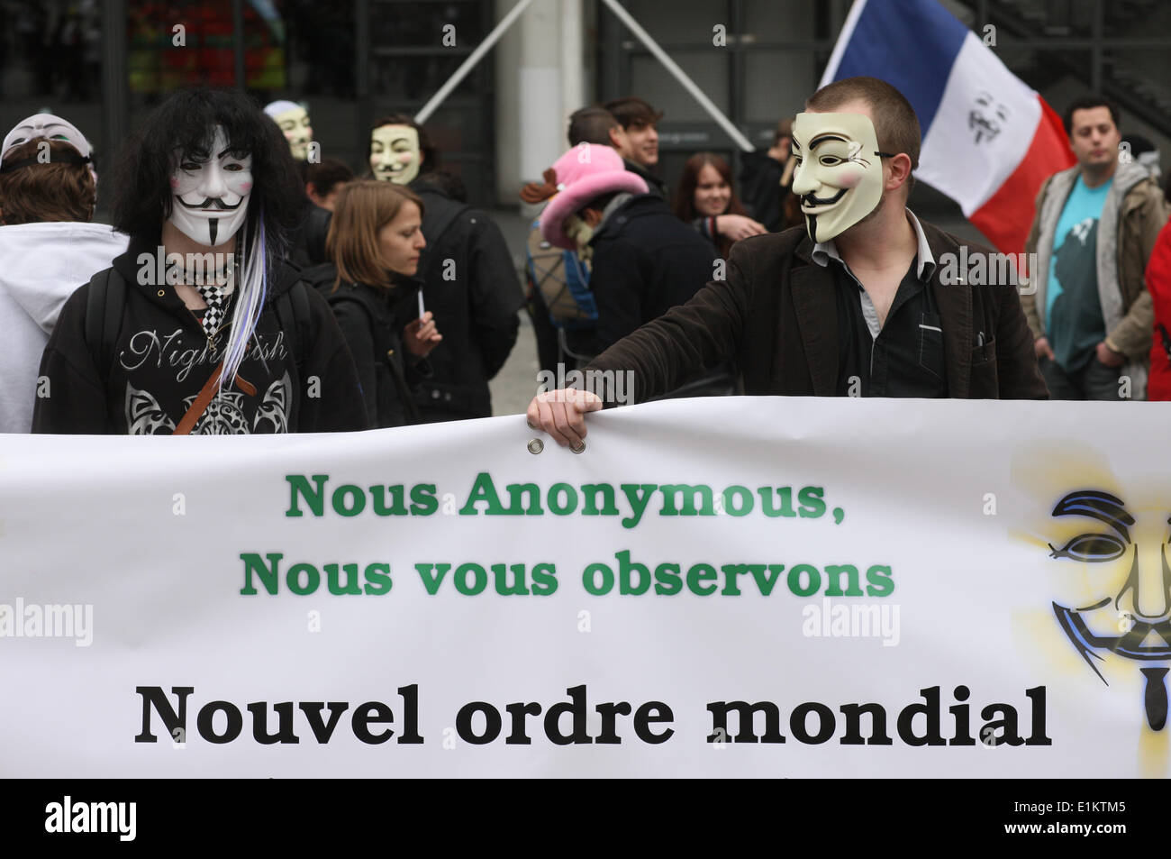 Demonstranten mit Guy Fawkes-Masken, eingetragenes Warenzeichen der Anonymous-Bewegung und basierend auf einem Charakter in dem Film V wie Vendetta. Stockfoto