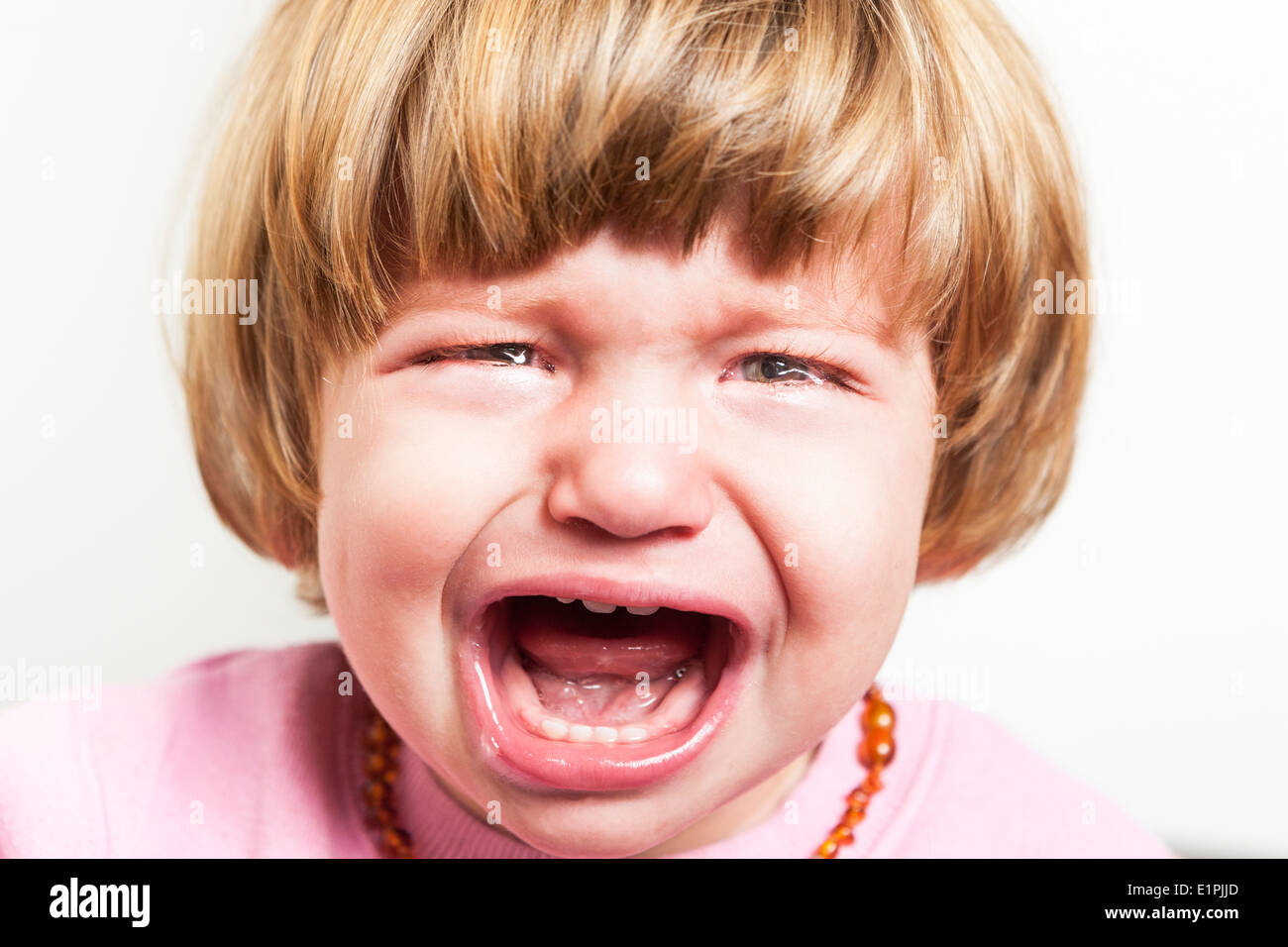 Porträt von Baby weint hautnah Stockfoto
