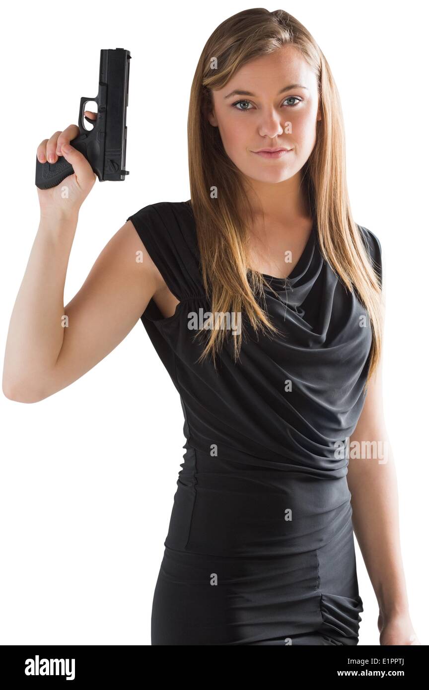 Femme Fatale zeigenden Waffe Stockfoto