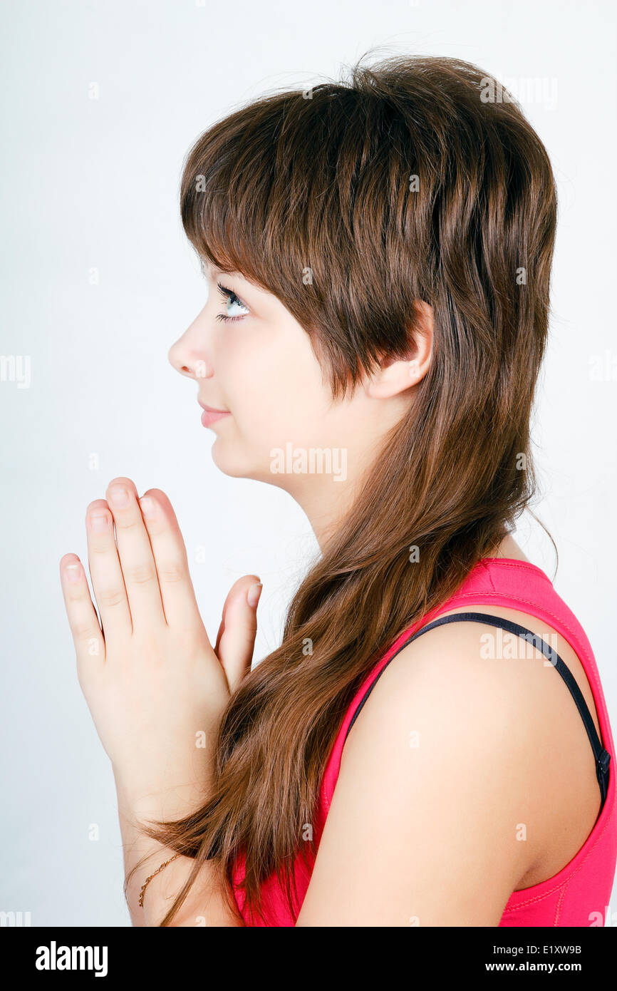 blauäugige Teen Mädchen beten. Profil Stockfoto