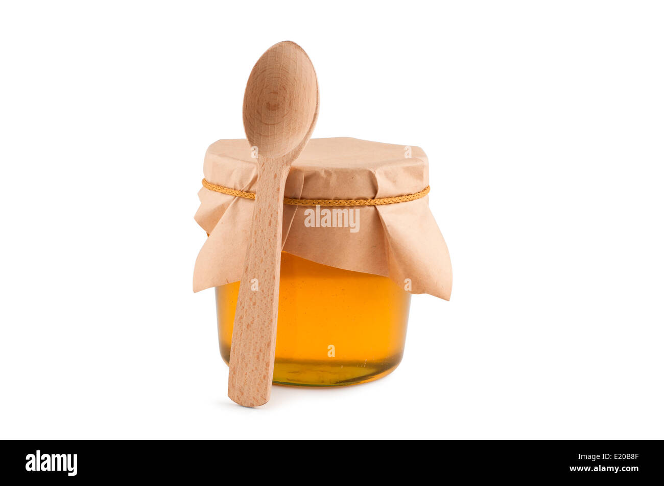 Honig im Glas, Löffel, isoliert weiss. Stockfoto