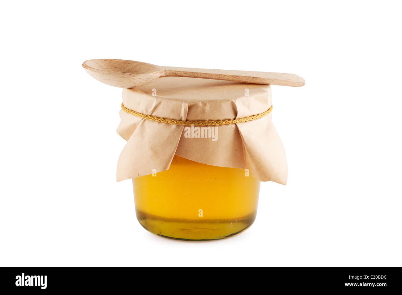Honig im Glas Holzlöffel isoliert. Stockfoto