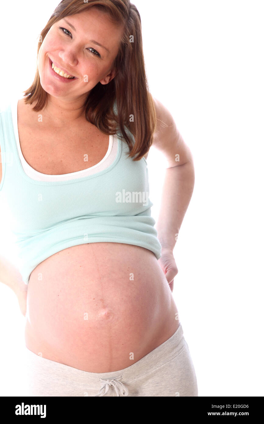Schwangere Frau lächelt glücklich Stockfoto
