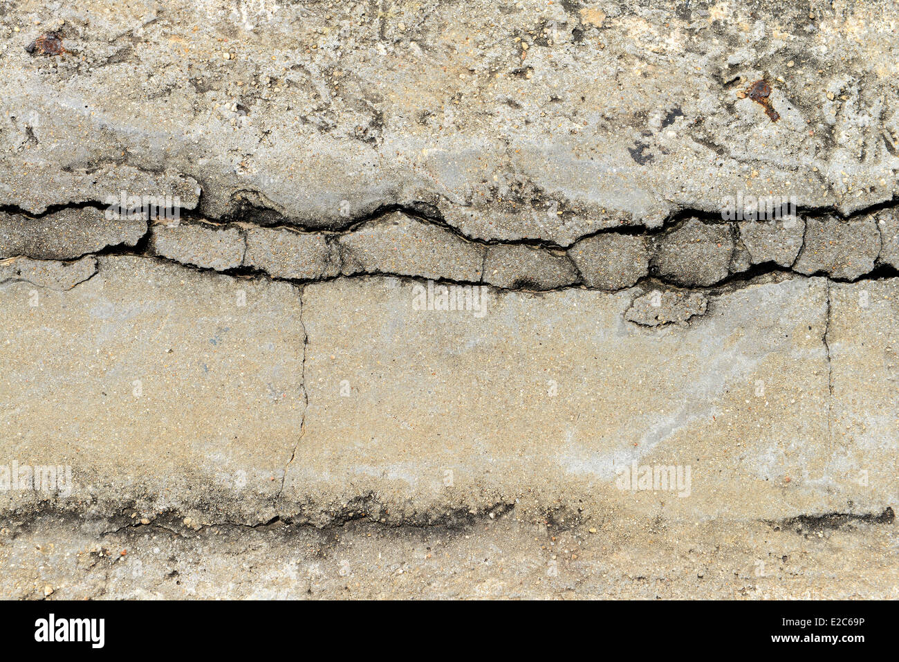 Zusammensetzung des gerissenen Beton Textur Closeup Hintergrund. Stockfoto