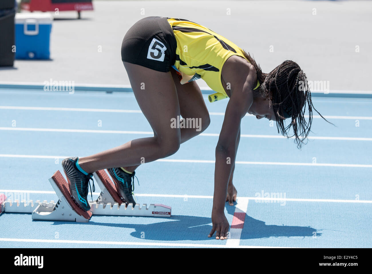 In den Startlöchern für die Metro 4X400M Damenstaffel beim 2014 Adidas Track &amp; Field-Grand-Prix. Stockfoto