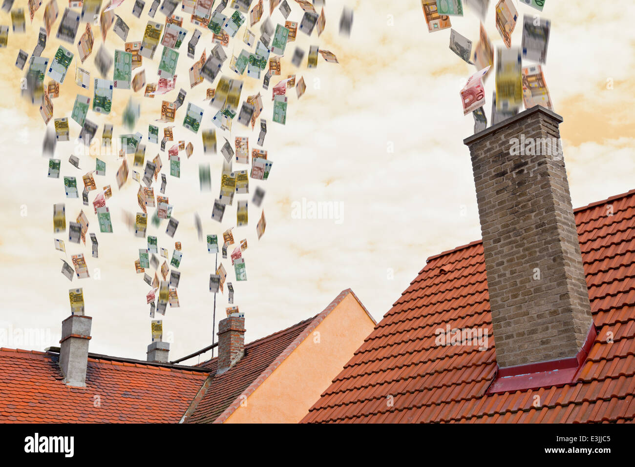 eine Menge von Euro fliegt herauf den Kamin Stockfoto