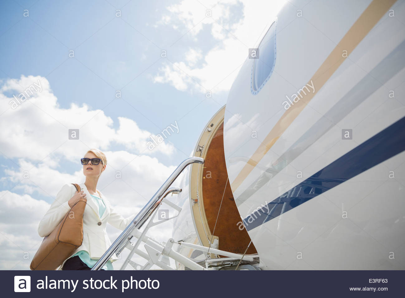 Geschäftsfrau Internat corporate jet Stockfoto
