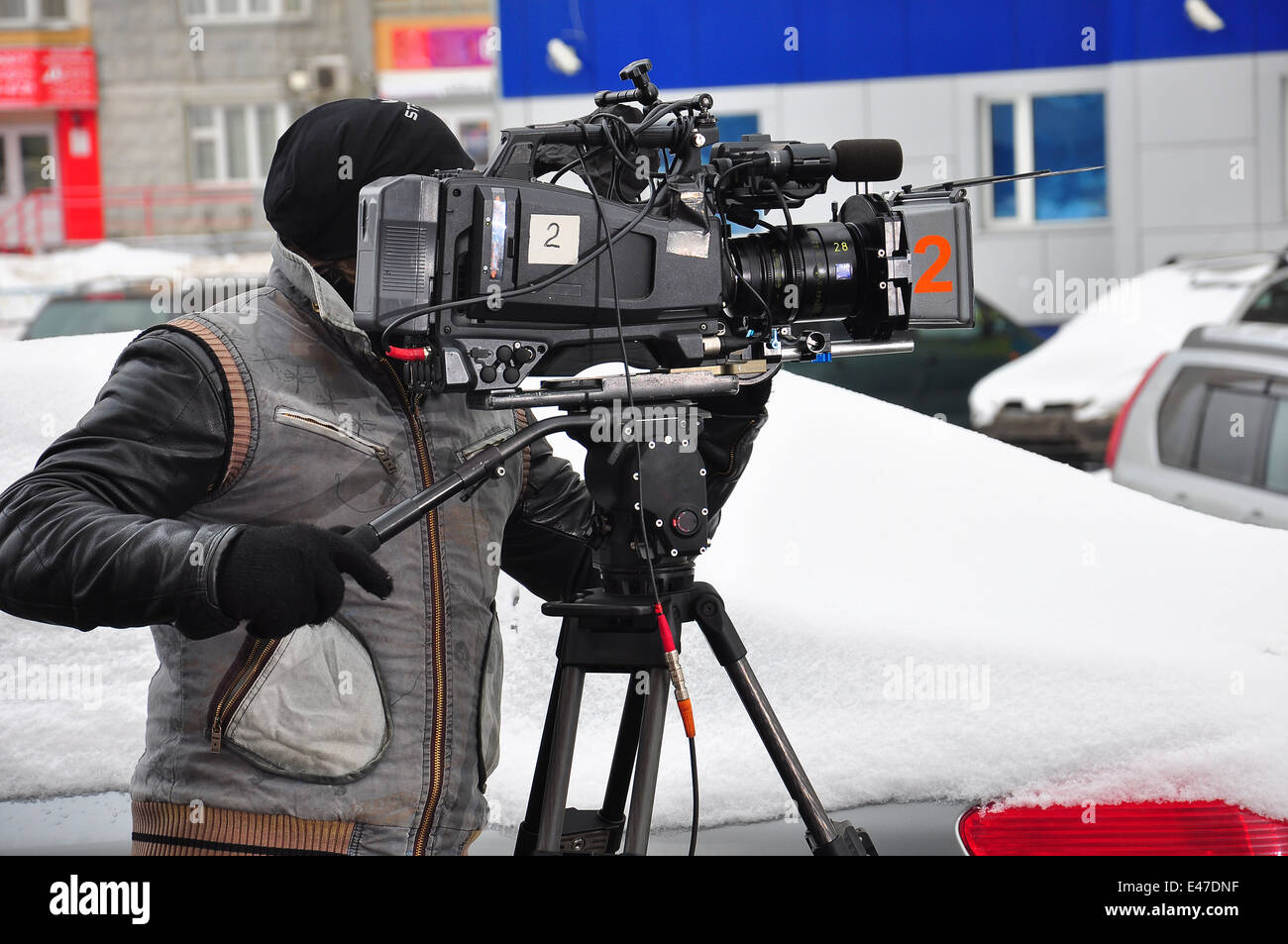 Rekord Reportage Reporter schießen Studio Technologie Fernsehen Stativ video arbeiten Videofilmer Stockfoto