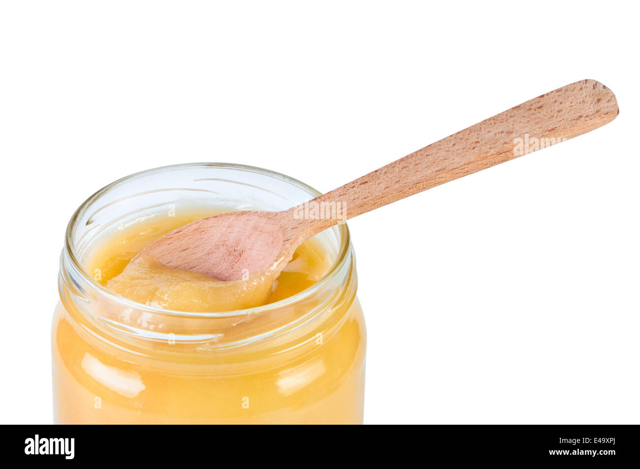 Honig im Glas mit einem Holzlöffel. Stockfoto
