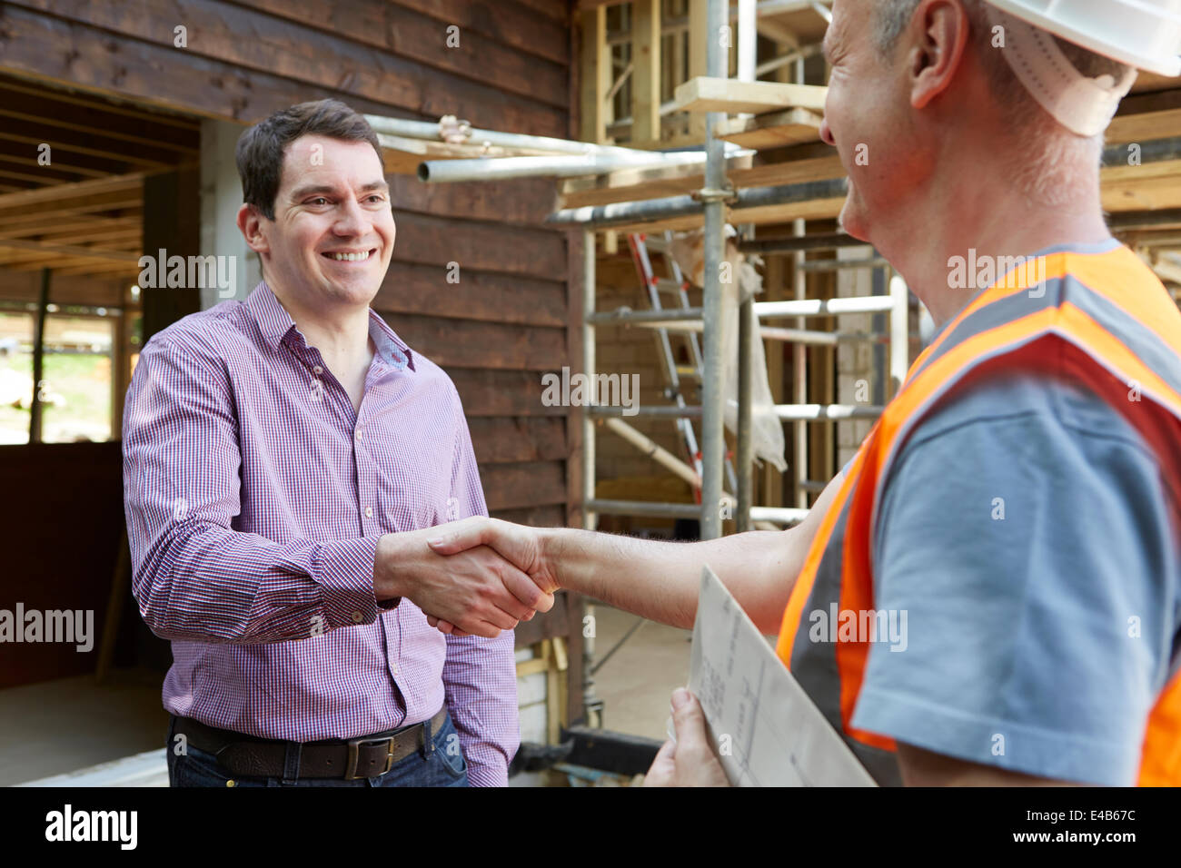 Kunden schütteln Hände mit Generator Stockfoto
