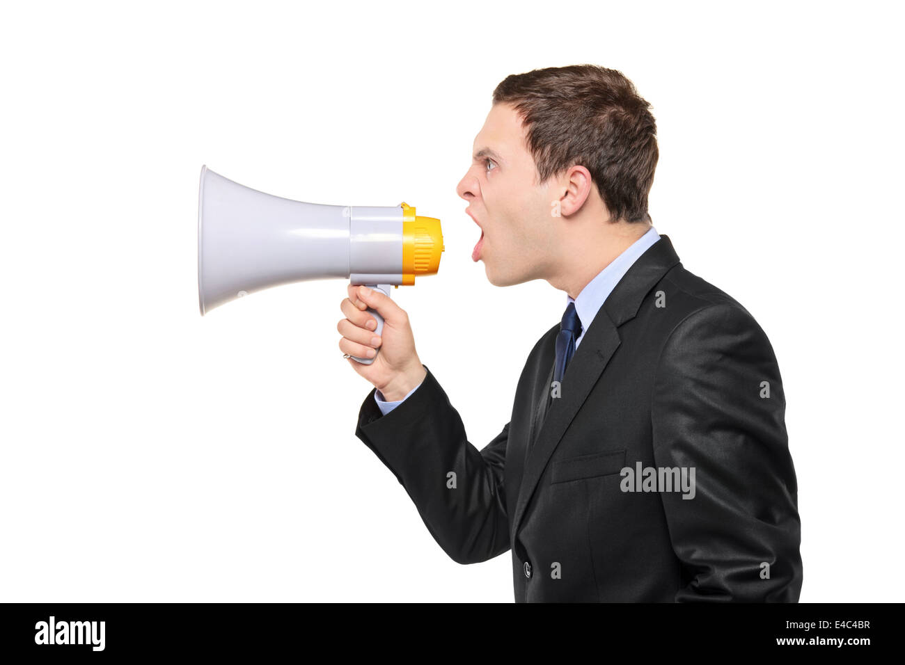 Junger Geschäftsmann auf einem Megaphon schreien Stockfoto