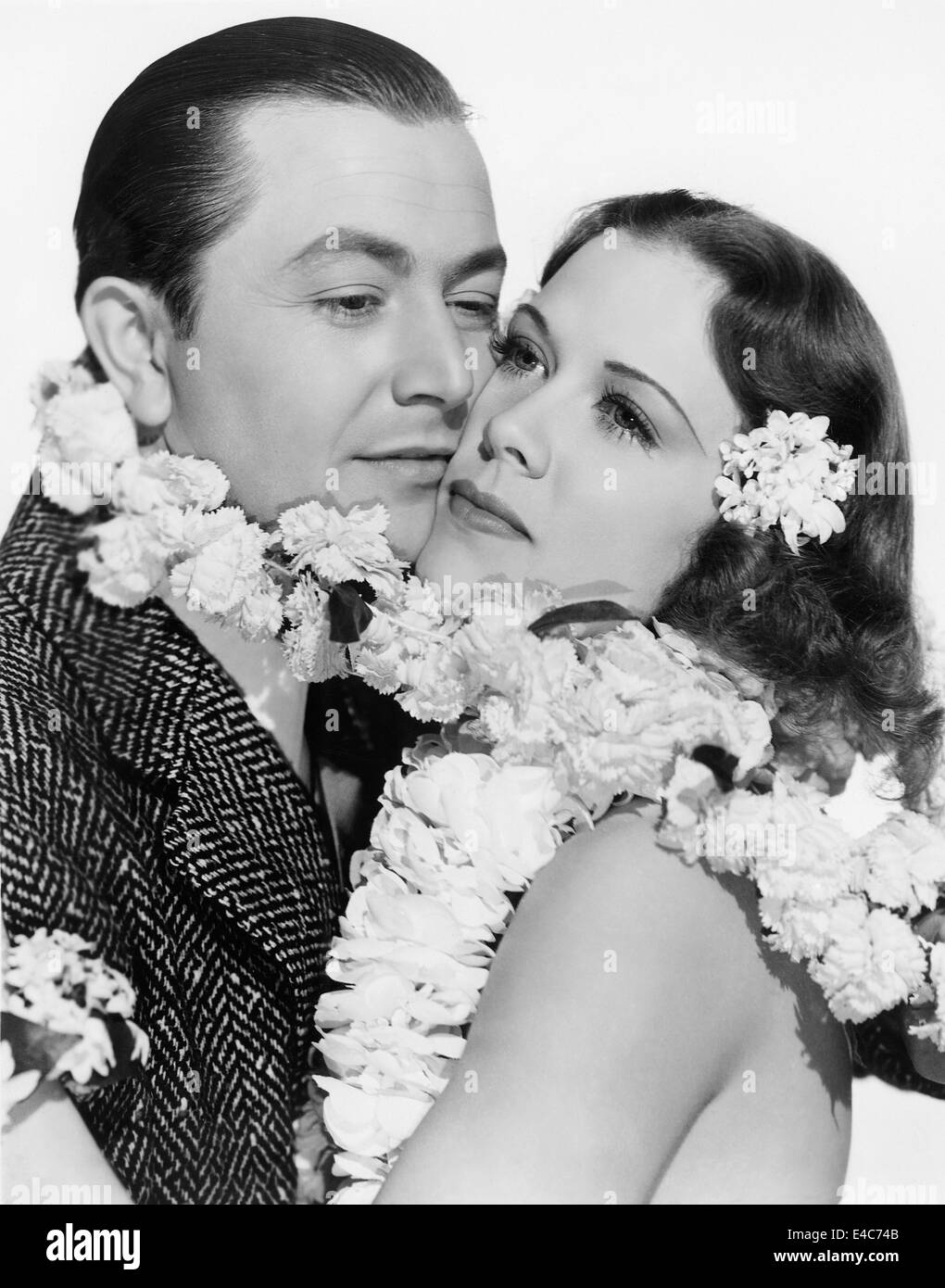 Robert Young, Eleanor Powell, Portrait Werbung für den Film "Honolulu", 1939 Stockfoto