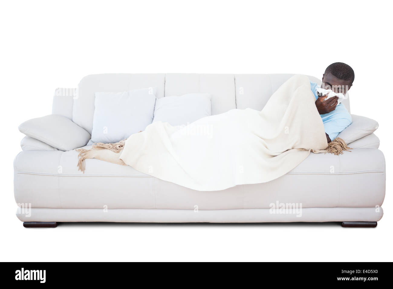 Kranker Mann auf seiner Nase weht Couch liegen Stockfoto
