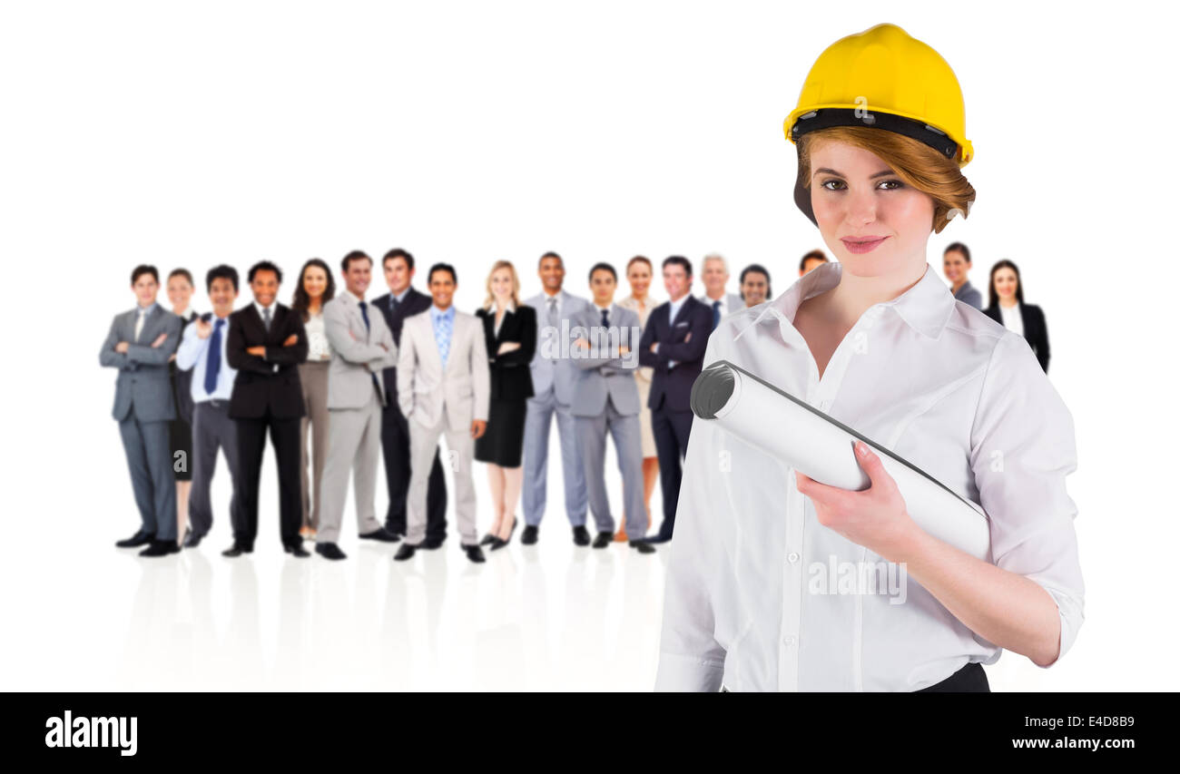 Zusammengesetztes Bild hübsche junge Architekten, die in die Kamera Lächeln Stockfoto