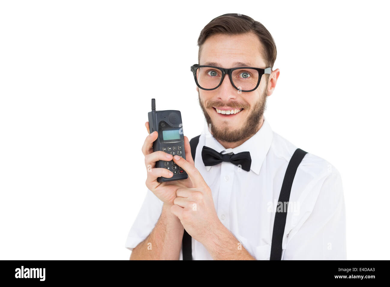 Geeky Hipster hält ein Retro-Handy Stockfoto