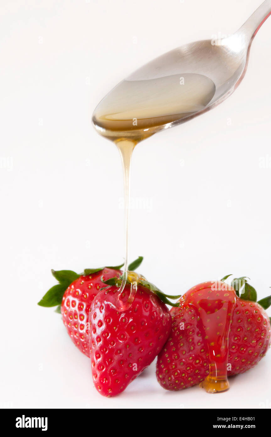 Erdbeeren und Honig Stockfoto