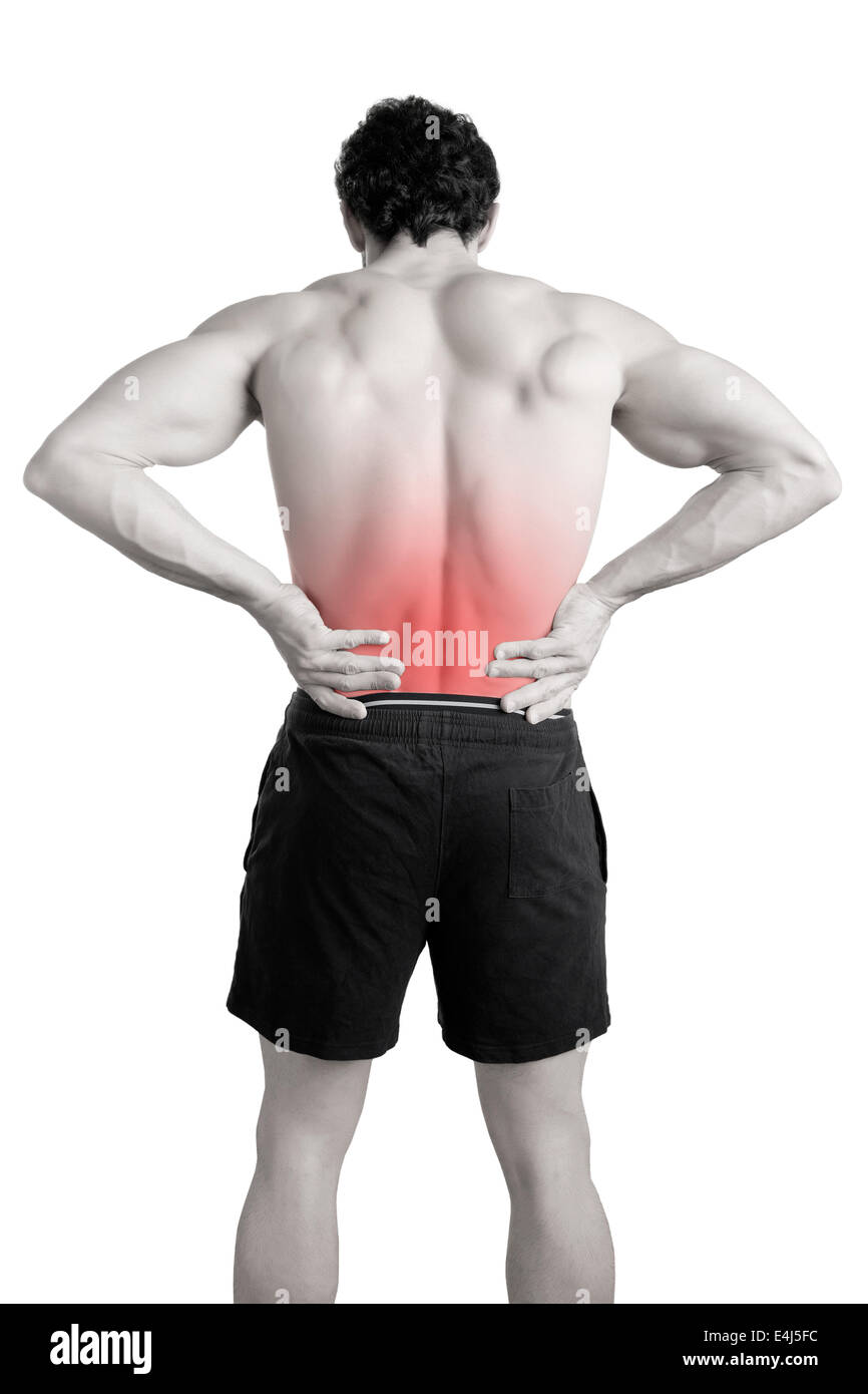 Sportler mit Schmerzen im unteren Rücken, isoliert in weiß. Roter Fleck um die schmerzende Stelle. Stockfoto