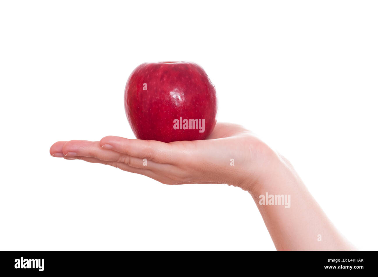 Roter Apfel in der hand Stockfoto