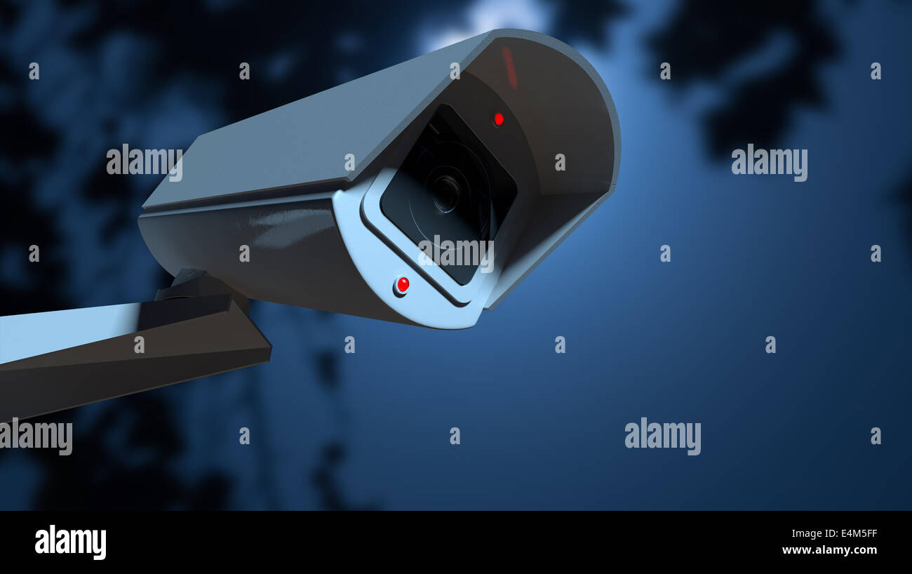 Eine weiße drahtlose Überwachungskamera mit leuchtenden Lichter in der Nacht-mit textfreiraum an einer Wand montiert. Stockfoto