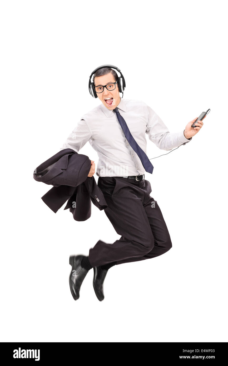 Ekstatische Geschäftsmann anhören von Musik auf seinem Handy Stockfoto