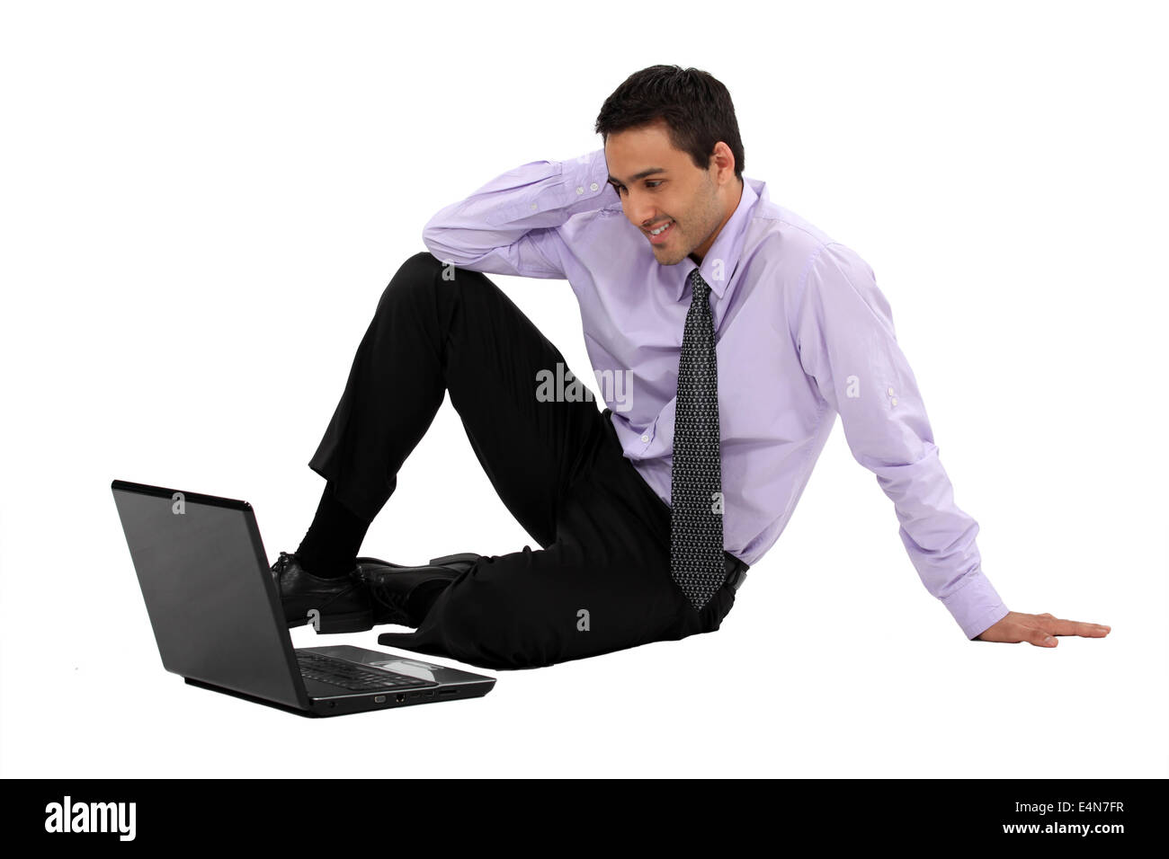 Geschäftsmann, einen Film auf seinem laptop Stockfoto