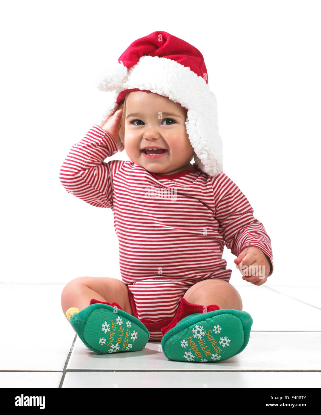 Baby Mädchen (12 Monate) tragen Weihnachten Stil Wollmütze Stockfoto