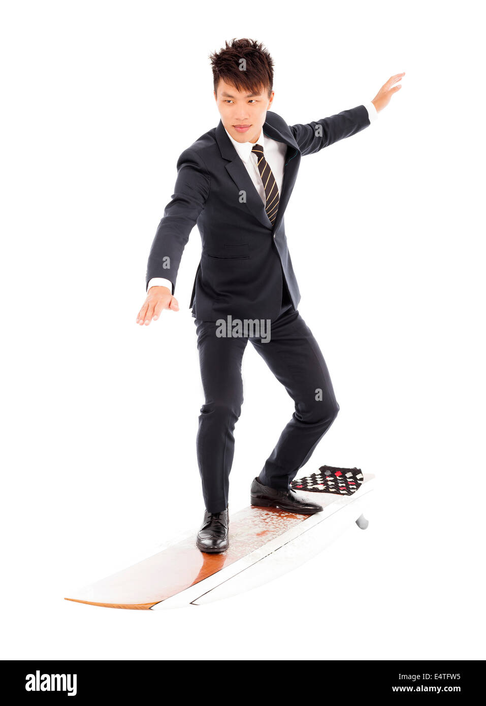 Geschäftsmann Praxis Surfen Pose mit Anzug Stockfoto