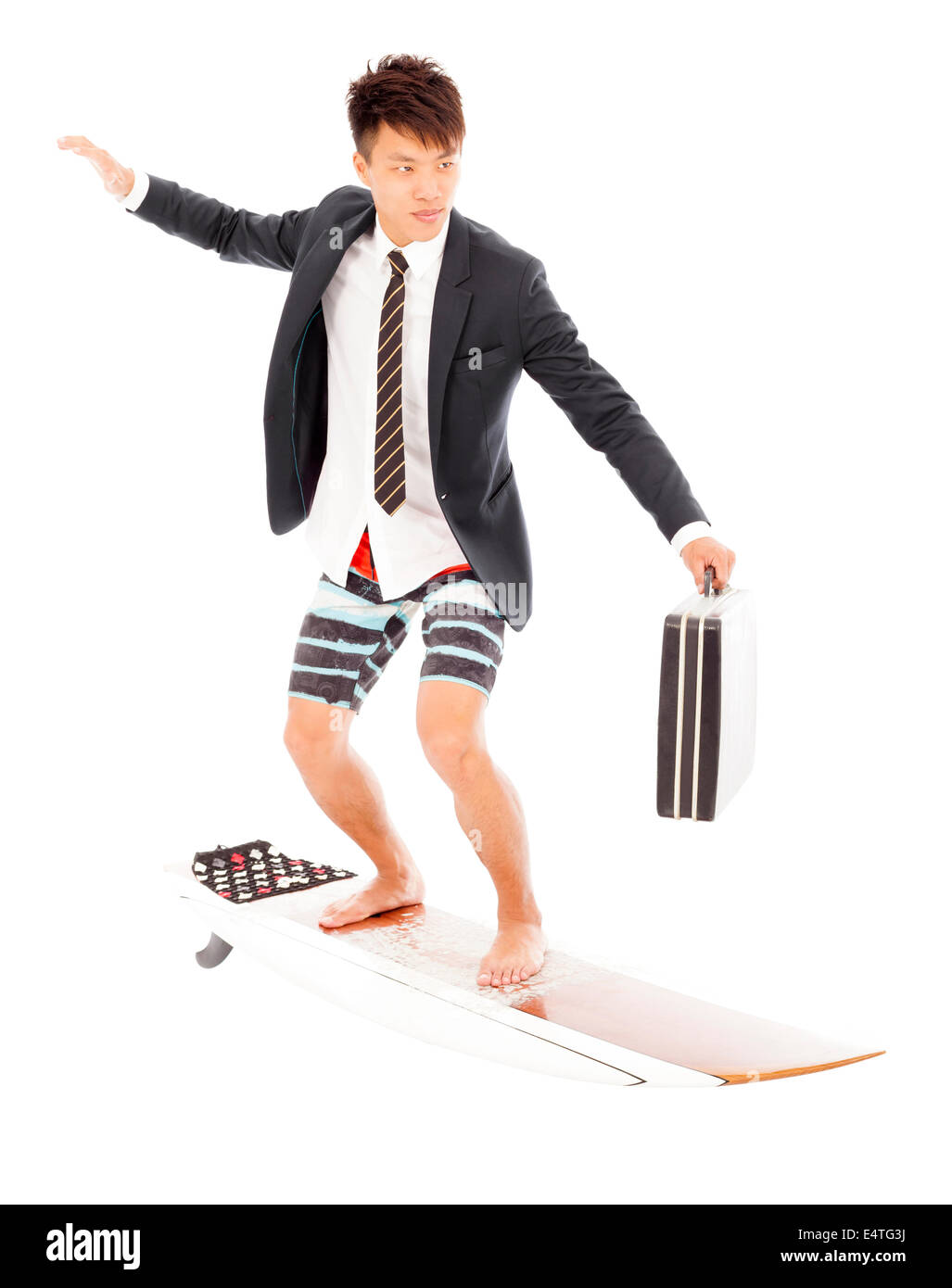 Business-Mann hält einen Aktenkoffer und ständigen Surf board Stockfoto