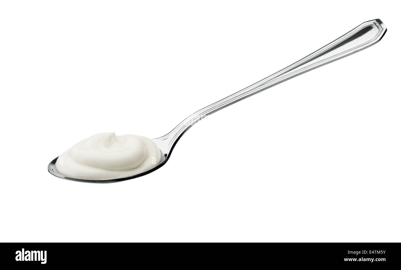 Teelöffel Joghurt isoliert auf weißem Hintergrund Stockfoto