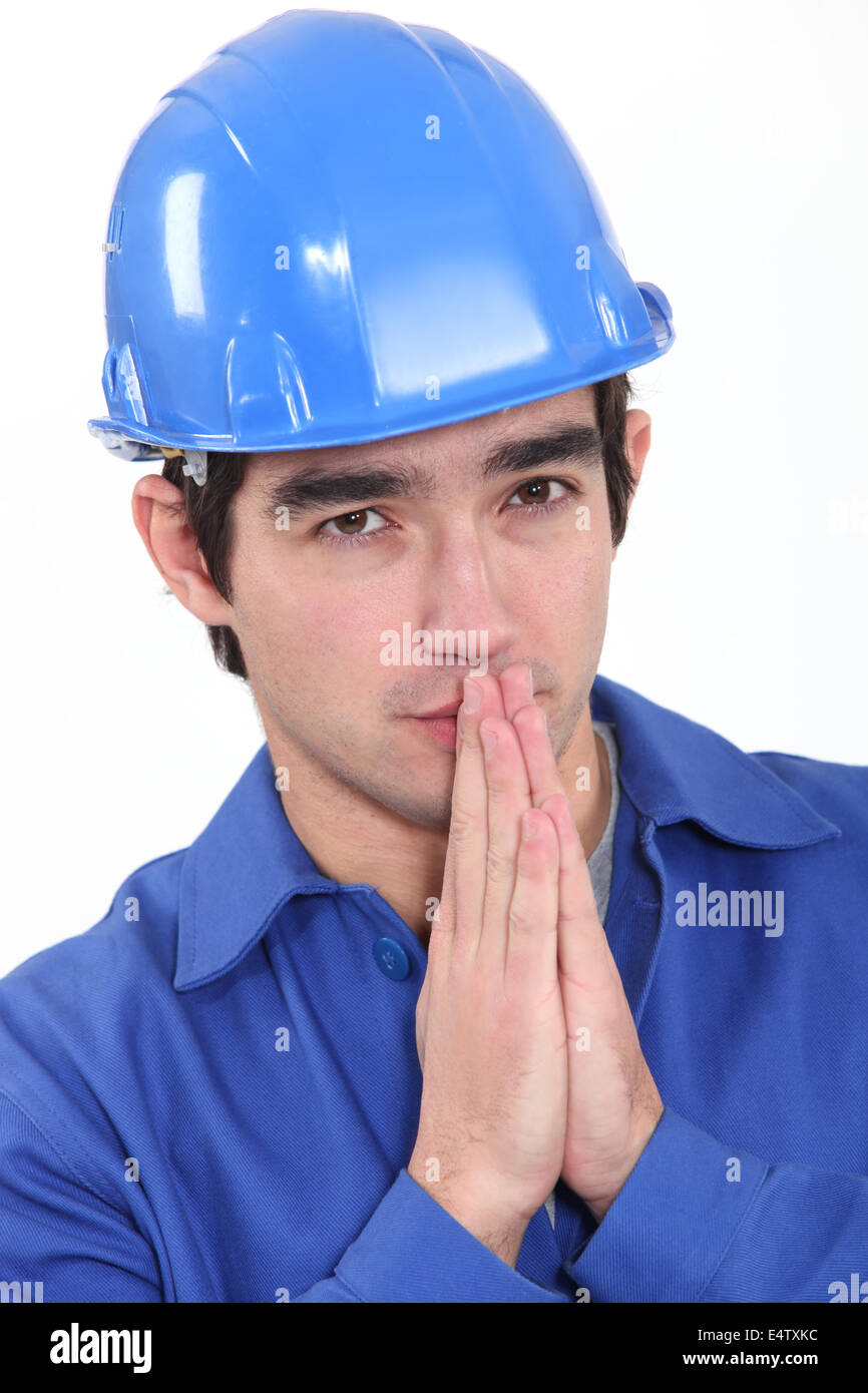 Handwerker, hoffen und beten Stockfoto