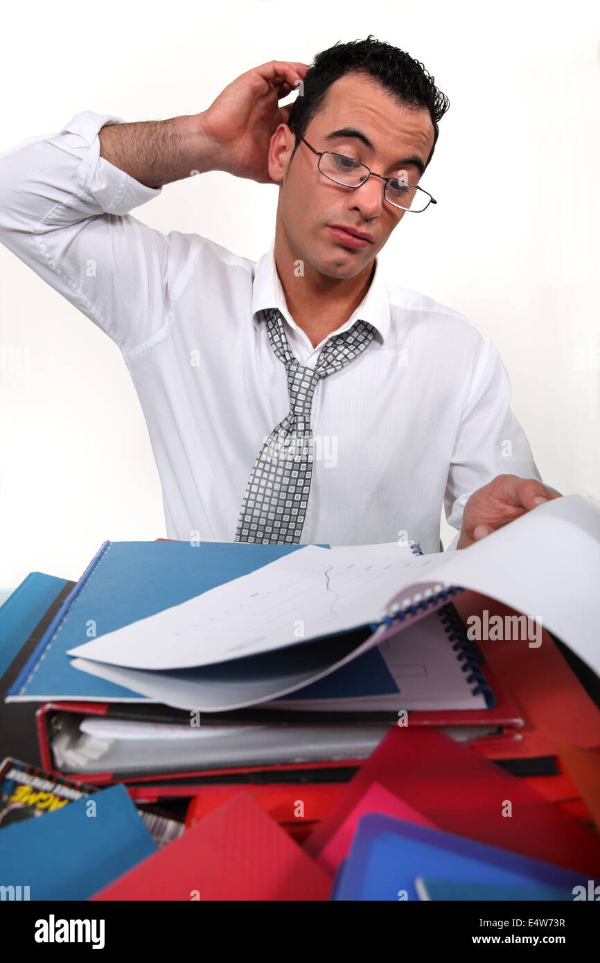 Ein Geschäftsmann, überwältigt. Stockfoto